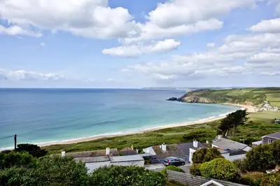 a view of the beach from a house at Spindrift - Hot Tub - Free WiFi - Free Parking - Pet Friendly in Praa Sands