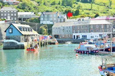 a group of boats are docked in a harbor at Fabulous 2 Bed Cottage - Outstanding Sea Views in Mevagissey