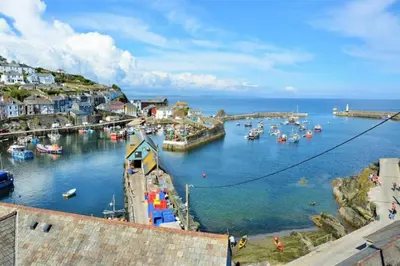a view of a harbor with boats in the water at Fabulous 2 Bed Cottage - Outstanding Sea Views in Mevagissey