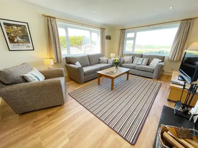 a living room with two couches and a coffee table at Sunnybank, Port Isaac Bay Holidays in Port Isaac