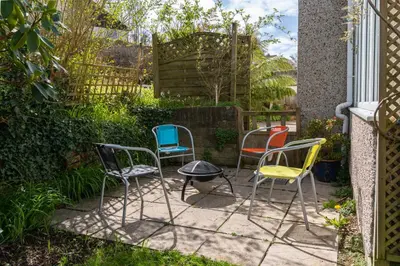 a group of chairs sitting on a patio at Finest Retreats - Tinners Rest in St Austell