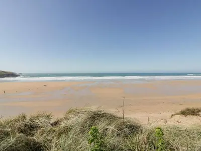a beach with the ocean in the background at 24 Atlantic Reach in Newquay