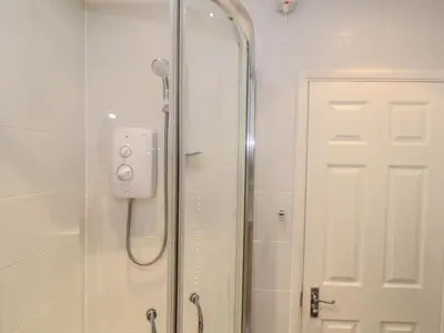 a shower with a glass door in a bathroom at 24 Atlantic Reach in Newquay