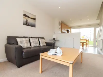 a living room with a couch and a coffee table at 24 Atlantic Reach in Newquay