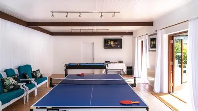 a living room with a ping pong table at Ta Mill Holiday Cottages & Lodges - Forge Cottage in Launceston