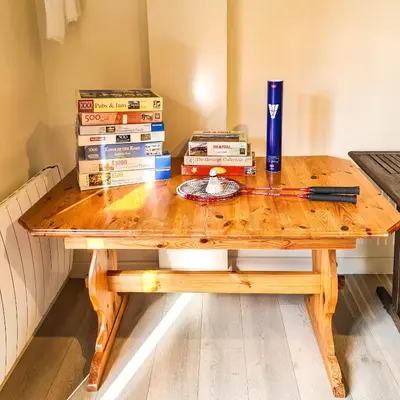 a wooden table with a stack of boxes at Ta Mill Cottages & Lodges - Dairy Cottage in Launceston