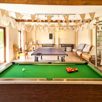 a pool table in a living room with a pool at Ta Mill Cottages & Lodges - Hayloft Cottage in Launceston
