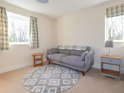 a living room with a couch and a table at Ilgram in Newquay