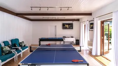 a living room with a ping pong table at Ta Mill Cottages & Lodges - Meadowview Chalet 2 in Launceston