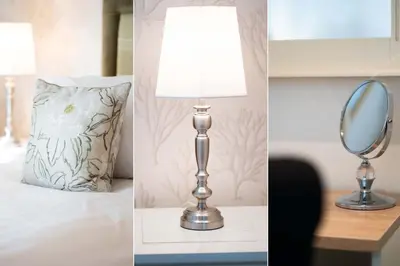 a floor lamp and a mirror on a table at Jack's Corner in St Ives