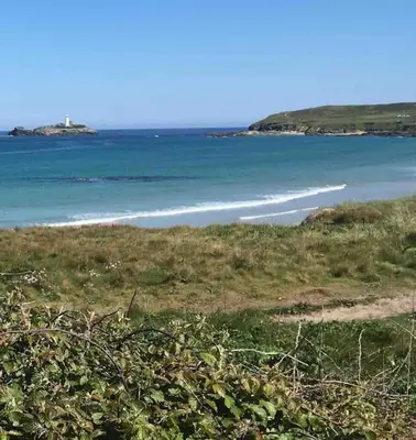 a view of a beach with the ocean at Stylish coastal retreat in St Ives with parking in St Ives