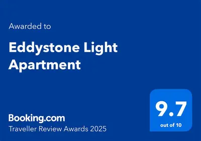 a blue sign with the text advanced to eligibility light appointment at Eddystone Light Apartment in Mevagissey