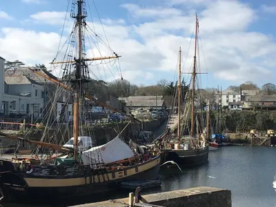 two boats docked in the water in a harbor at Bay View, Millendreth Looe Cornwall in Looe