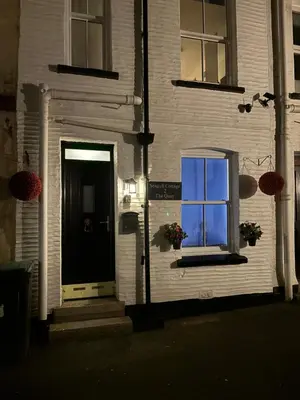a building with a window on the side of it at Seagull Cottage in Looe