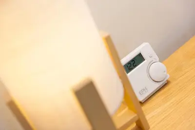 an alarm clock sitting on top of a table at The Annex - Trewolla Cottage in Newquay