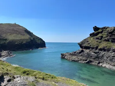 a view of the ocean from a cliff at Amal Anpras in Tintagel