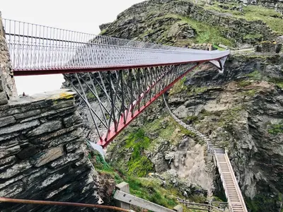 a suspension bridge on the side of a mountain at Badgers Rest in Tintagel