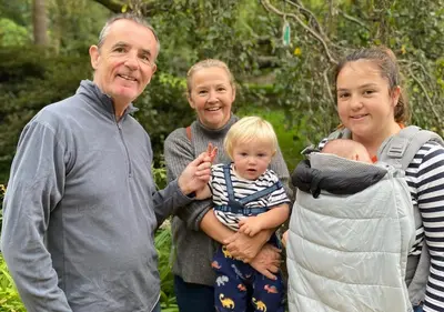 an older man and two women holding a baby at Minimoor Lodge in Scorrier