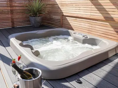 a jacuzzi tub sitting on a deck at Rosewarrick Cottage in Bodmin