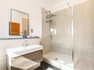 a bathroom with a sink and a shower at Rosewarrick Cottage in Bodmin