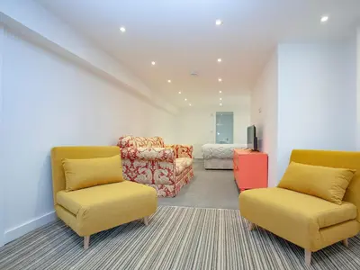 a living room with two chairs and a couch at Crofty's Celder - Uk35181 in Pool