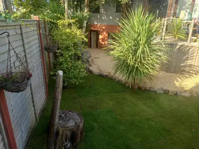 a garden with plants and a fence and a yard at Crofty's Celder - Uk35181 in Pool
