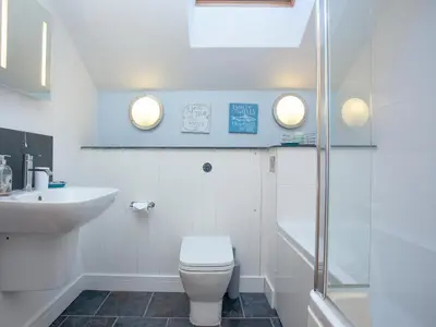 a bathroom with a toilet and a sink and a shower at The Hayloft - Uk36516 in Germoe