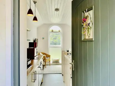 a hallway with a green door in a kitchen at 1 Bed Cottage - Sleeps 2 - Parking - Wifi in Truro