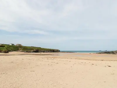 a sandy beach with the ocean in the background at Constantine Bay Cottage in Padstow