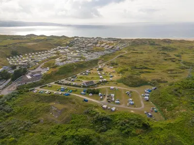 an aerial view of a parking lot near the ocean at St Ives Bay Beach Resort in Phillack