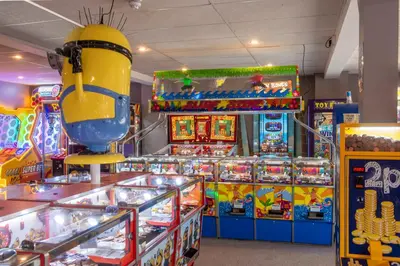 a group of pinball machines in a room at St Ives Bay Beach Resort in Phillack