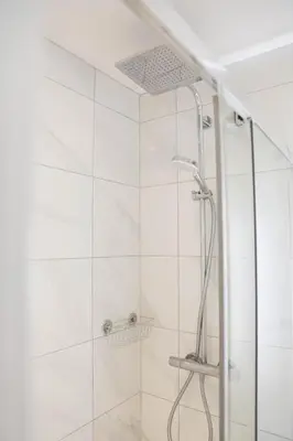 a bathroom with a shower with a glass door at Mortham in St Merryn