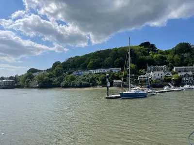 a group of boats docked at a dock in the water at 4 Trenhaile Terrace in Truro