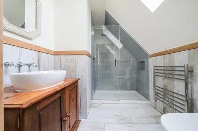 a bathroom with a sink and a walk in shower at Glebe Cottage, Little Petherick, near Padstow in Little Petherick