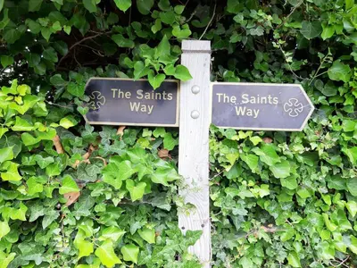 two signs on a pole in front of a bush at Glebe Cottage, Little Petherick, near Padstow in Little Petherick