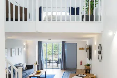a living room with a couch and a table at Helford in Mawnan