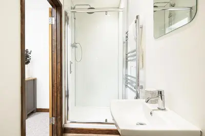 a bathroom with a sink and a shower at Pendeen in Falmouth