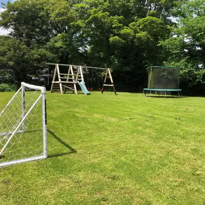 a field with a soccer goal and a playground at Pendeen in Falmouth