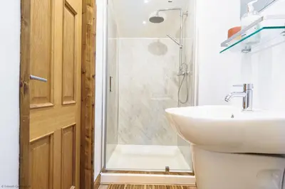 a bathroom with a sink and a shower at St Keverne in Budock Water