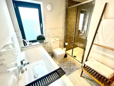 a bathroom with a sink and a shower and a toilet at Avalennek in Newquay