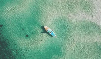 an aerial view of a boat in the water at Pentire Point - Fully Equipped Eco Escape in Crantock