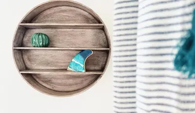 a wooden shelf with a cactus on it next to a curtain at Pentire Point - Fully Equipped Eco Escape in Crantock