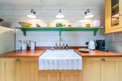 a kitchen with a sink and a counter top at Secret Cottage in St Ives