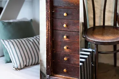 a wooden dresser and a chair next to a bed at Secret Cottage in St Ives