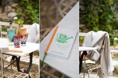 a table with a sign and a bottle of wine at Secret Cottage in St Ives