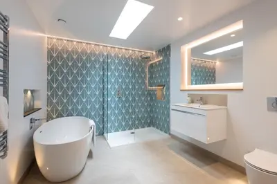 a bathroom with a tub and a sink at The Old Coastguard Lookout in Port Isaac