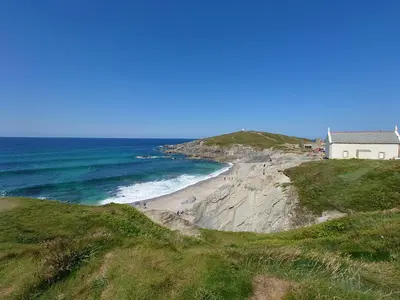a house on a hill next to a beach at White Acre's Holiday Park, 602 Sycamore Forest in Saint Enoder