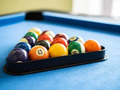 a bowl of billiard balls on a pool table at Lamorna in Port Isaac