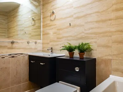 a bathroom with a sink and a toilet and a tub at Lamorna in Port Isaac