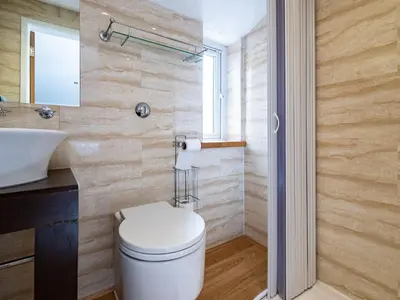 a bathroom with a toilet and a sink at Lamorna in Port Isaac